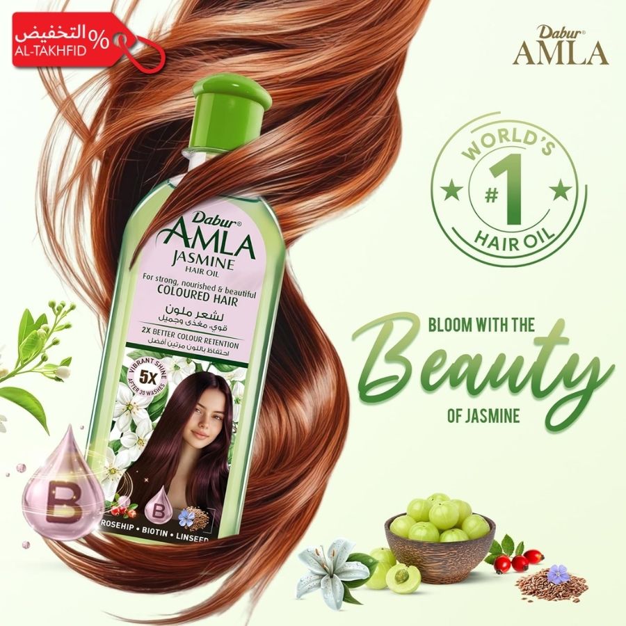 Dabur Amla Jasmine hair oil bottle with brown hair and green leaves on a white background