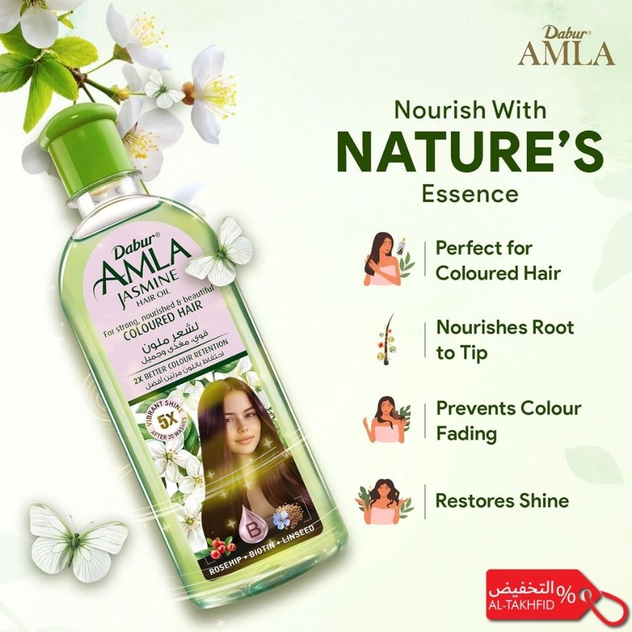 Dabur Amla hair oil bottle with product features on a white background.