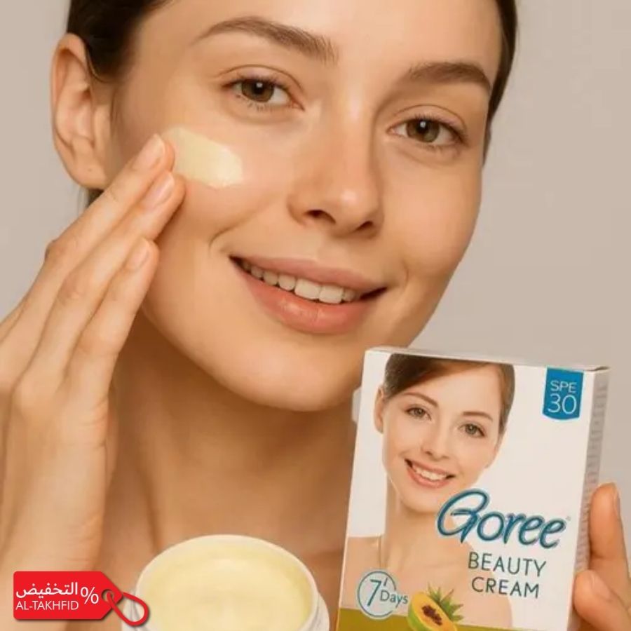 Woman applying cream to her face with a box of Goree Beauty Cream in the foreground.