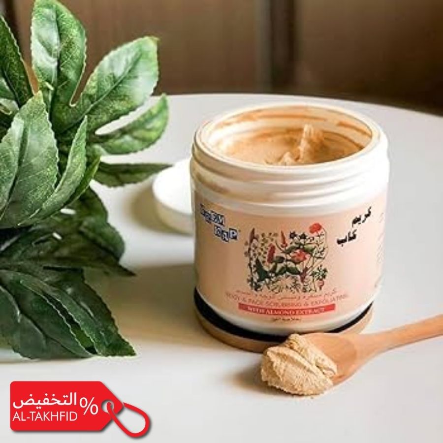 Jar of Krem Kab Scrubbing Cream with a spoonful on a table next to a plant, with promotional text at the bottom.