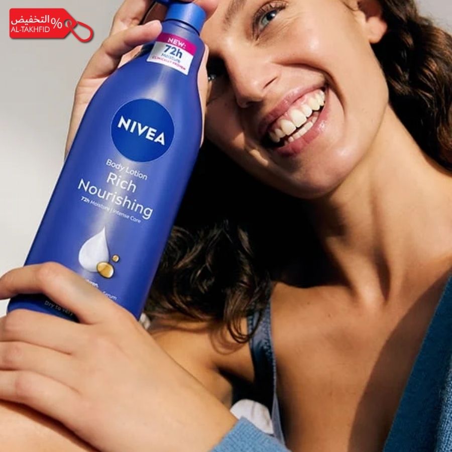 Woman holding a Nivea body lotion bottle with a visible discount label.