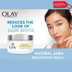 Olay Natural Aura Brightening Cream with a model's using the product.