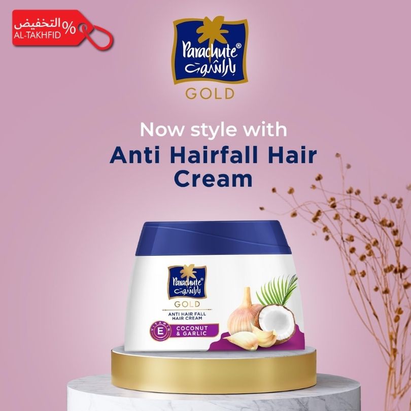 Parachute Gold Anti Hairfall Hair Cream container on a pink background