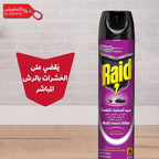 Raid insect killer spray can on a wooden surface with Arabic text and a red logo.