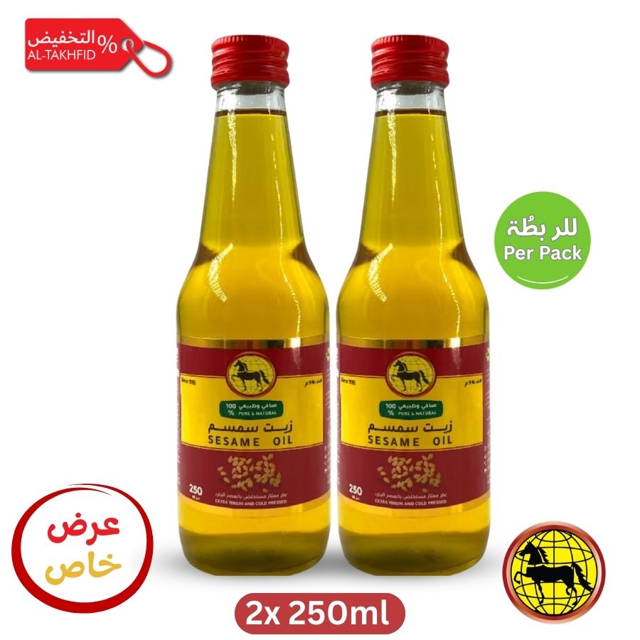 Two bottles of sesame oil with red lids on a white background