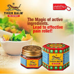 Tiger Balm Red Ointment packaging with promotional text on a blurred natural background