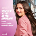 Woman with long hair smiling, Sunsilk advertisement on a pink background